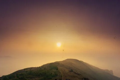 SUNSET ON THE BEAUTIFUL MOUNTAIN RANGES Stock Photos