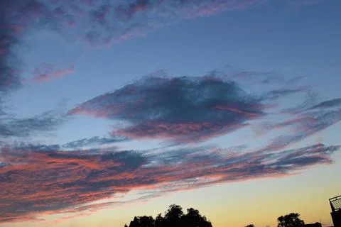 Sunset with beautiful red clouds in sky background Stock Photos