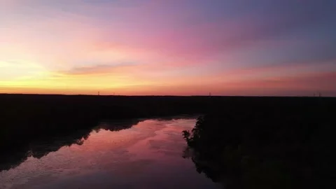 Sunset with beautiful reflection on the lake from above 스톡 동영상 132608816