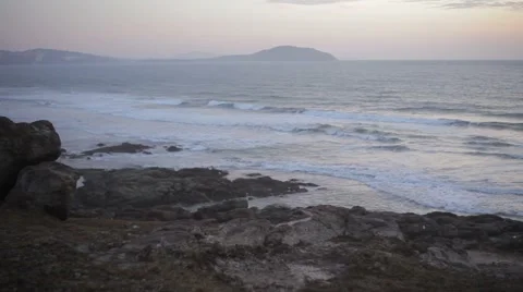 Sunset on the beautiful rocky beach, panorama. Very picturesque landscape. Stock Footage 44265576