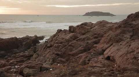 Sunset on the beautiful rocky beach. Very picturesque landscape. Stock Footage 44265586