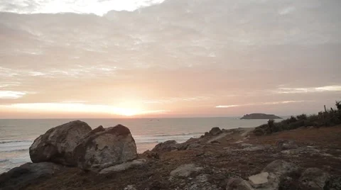 Sunset on the beautiful rocky beach. Very picturesque landscape. Stock Footage 44265610