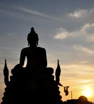 Sunset behide buddha image Stock Photos