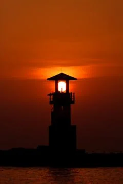 Sunset behide lighthouse Stock Photos