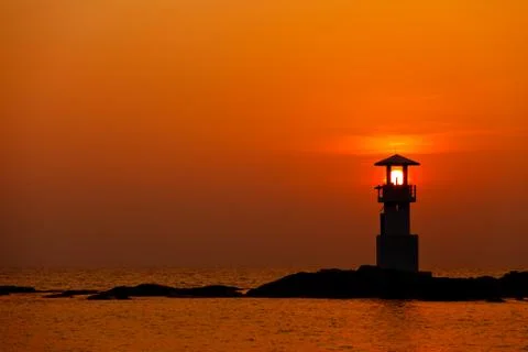 Sunset behide lighthouse Stock Photos
