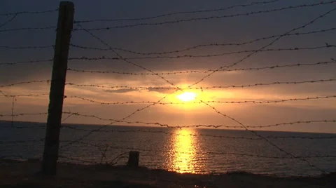 Sunset behind the barbed wire Stock Footage 30840827