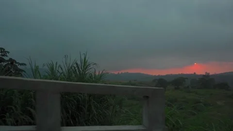 Sunset Behind a Barn with Mountains Stock Footage 293662974
