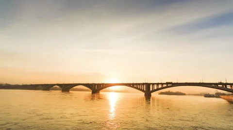 Sunset Behind the Bridge  the bridge over the Yenisei river, Krasnoyarsk, Russia Stock Footage 57668365