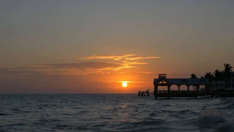 SUNSET BEHIND CASA at Waterfront beach in Key West Florida Stock Footage 107574085