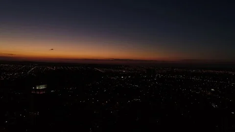 Sunset behind City Skyline - Silhouettes Stock Footage