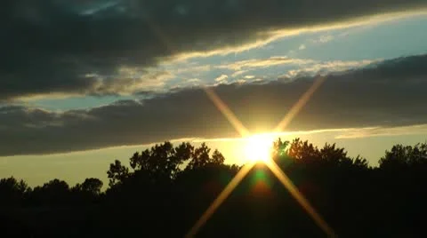 Sunset behind the cloud - Timelapse Stock Footage 8949236