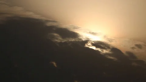 Sunset behind clouds Stock Footage 120018157