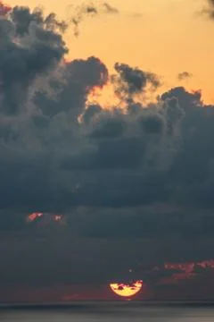 Sunset Behind the Clouds Foto stock