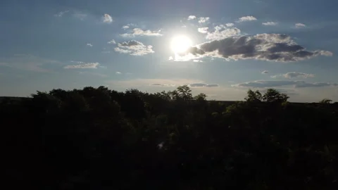 Sunset behind the clouds as seen from a drone Stock Footage 256501276