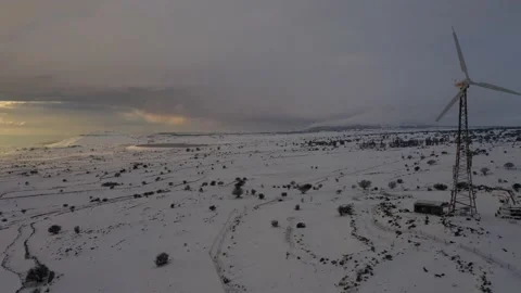 Sunset behind clouds on snowy land Stock Footage 149042363