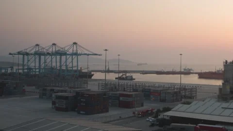 Sunset behind container and sea in customs zone Stock Footage 145200732