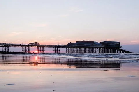 Sunset behind Cromer pier Fotos Stock