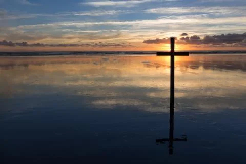Sunset behind cross Stock Photos