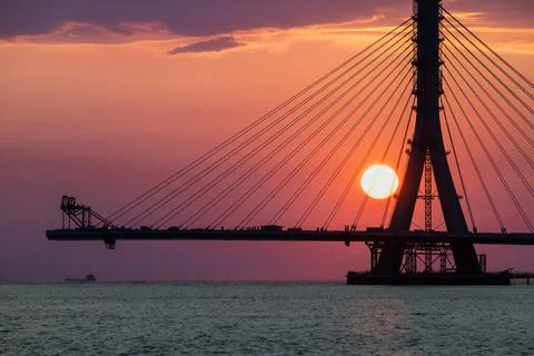 Sunset Behind Danjiang Bridge Under Construction in Tamsui New Taipei City. Stock Photos