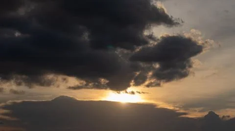 Sunset Behind Dark Clouds Stock Photos