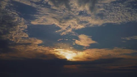 Sunset behind dramatic clouds in the blue sky Stock Footage 107071644