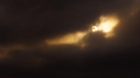 Sunset behind dramatic cloudy sky glowing above distant Taichung skyline Stock Footage 312278095