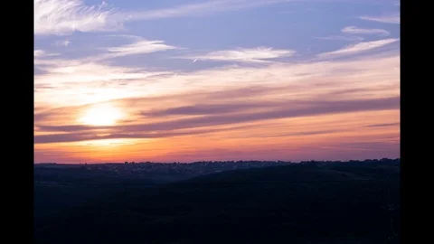 Sunset behind hill Stock Footage