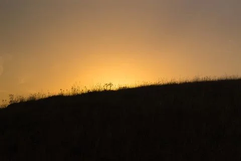 Sunset behind the hill Stock-Fotos