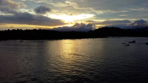 Sunset Behind Hills Over Calm Ocean in Sabang Video stock 311786730