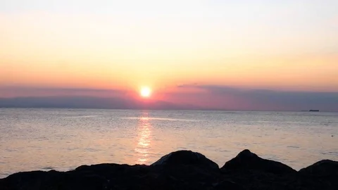 Sunset behind Hills on Seaside - Time lapse Stock Footage 123766615