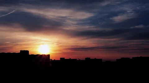 Sunset behind the houses Видео 39931845