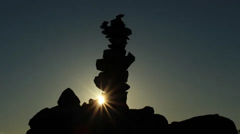 Sunset behind inukshuk Stock Footage 40106559