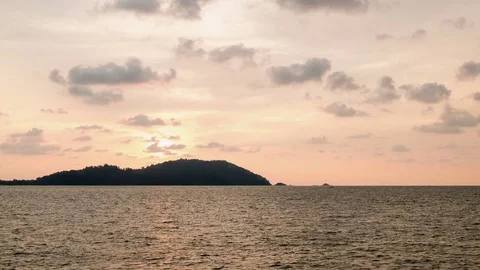 Sunset Behind Island 4K Stock Footage 81087441