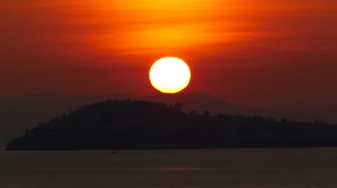 Sunset behind island. Stock Footage 68673579
