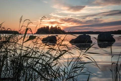 Sunset behind island. Stock Photos