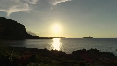 Sunset Behind Island In The Sea, Sicily, Italy Stock Footage 178868614