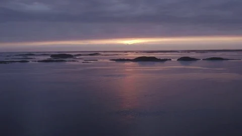 Sunset behind islets Stock Footage 79475358