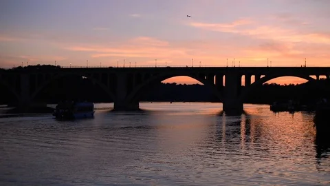 Sunset behind the Key Bridge, which connects Arlington, VA to Georgetown, DC Stock Footage 112582097