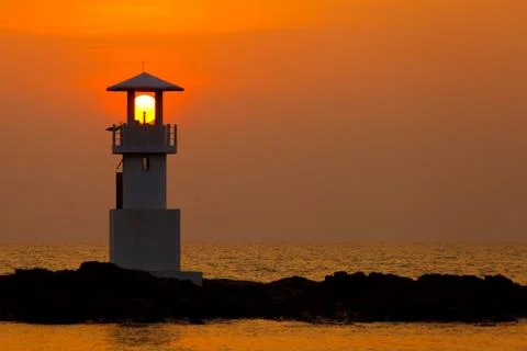 Sunset behind lighthouse Stock Photos