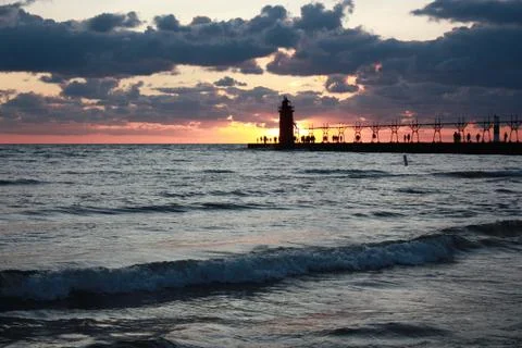 Sunset behind the lighthouse Stock Photos