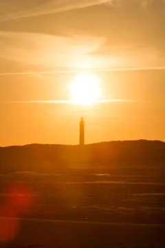 Sunset behind lighthouse Stock Photos