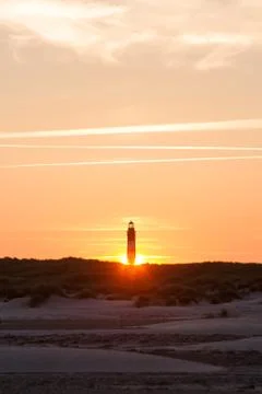 Sunset behind lighthouse Stock Photos
