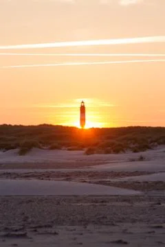 Sunset behind lighthouse Stock Photos