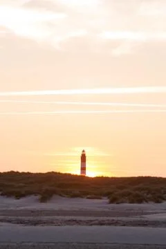 Sunset behind lighthouse Stock Photos