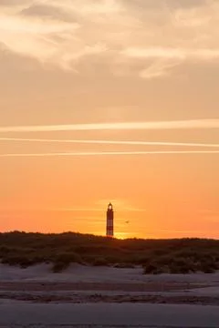 Sunset behind lighthouse Stock Photos