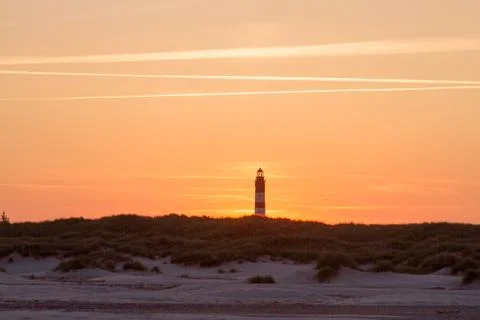 Sunset behind lighthouse Stock Photos