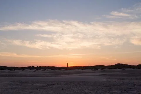 Sunset behind lighthouse Stock Photos