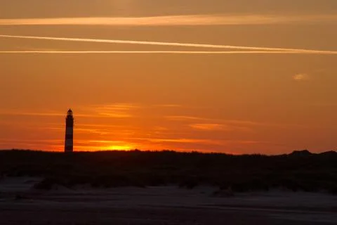Sunset behind lighthouse Stock Photos