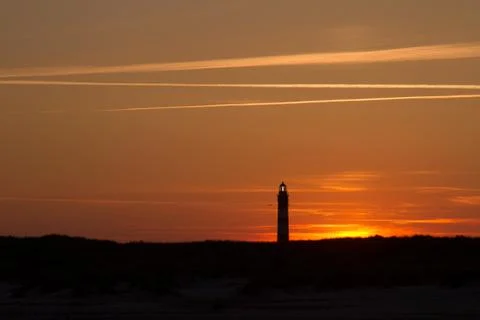 Sunset behind lighthouse Stock Photos