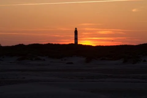Sunset behind lighthouse Stock Photos